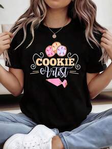 Nueva camiseta de moda para mujer con cuello redondo, diseño de ilustración de comida 2026 con patrón de artista COOKIE, talla. Adecuada para estudios de repostería, tiendas de postres, mercados de alimentos y eventos de repostería entre padres e hijos. De manga corta, perfecta para el estilo urbano diario. Una camiseta versátil adecuada para todas las estaciones. Diseño versátil para el verano. - Negro - Ver 1