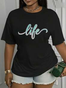 Camiseta Estampada para Mujer con Diseño Gráfico - Camiseta Casual de Manga Corta y Cuello Redondo en Estilo Versátil. Con un Corte Relajado para Todas las Estaciones, Perfecta para el Uso Diario o tus Atuendos de Vacaciones (Lavable aáquina). Combínala con Shorts de y un Elegante Bolso Verde de Cocodrilo para un Look Chic. - Negro - Ver 1