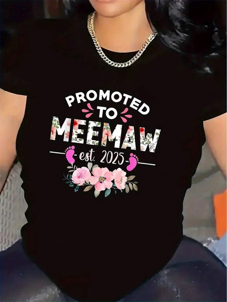 Camiseta de mujer, duradera y ligera, con un diseño floral que incluye la frase "Promovida a abuela", adecuada para un uso diario cómodo, con un tejido elegante y transpirable. - Negro - Ver 1