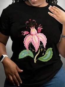 Camiseta Estampada de Cuello Redondo para Mujer Talla Grande - Elegante diseño floral en rosa y blanco con ribete dorado de hojas verdes - Camiseta casual suave para uso diario, lavable a máquina, camisa de moda de verano de talla grande - Adecuada para conjuntos de primavera/verano y ocasiones formales, diseño vibrante, material duradero, estilo moderno, ideal para compradoras Blusas Para Mujer Casual - Negro - Ver 1