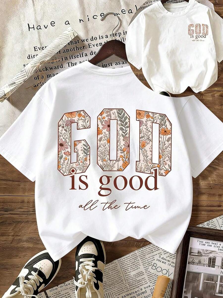 Women's Short-Sleeved T-Shirt With A Double Print (Front And Back) Of The Slogan "GOD Is Good All", With The Letters Filled With Vintage Floral Motifs. It Conveys A Tender And Comforting Feeling. A Retro American Style That Enhances Natural Elegance In Any Everyday Look. - 黑色 - 查看 1