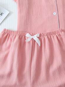 Conjunto de pijama de 2 piezas con top de manga corta con botones y shorts con lazo, de unicolor con detalles contrastantes en el cuello, bolsillo y decoración de corazón, adecuado para uso en casa - Rosa - Ver 6