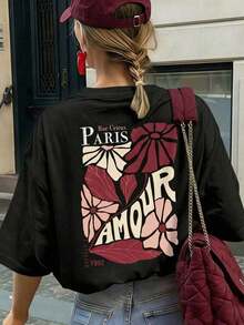Camiseta de manga corta con cuello redondo y estampado floral "Paris Lover" en color crema para mujer, corte holgado informal, estilo parisino, estilo romántico, para paseos por la ciudad, citas nocturnas, temporada de flores de cerezo, ideal para brunch, primavera/verano. - Negro - Ver 2
