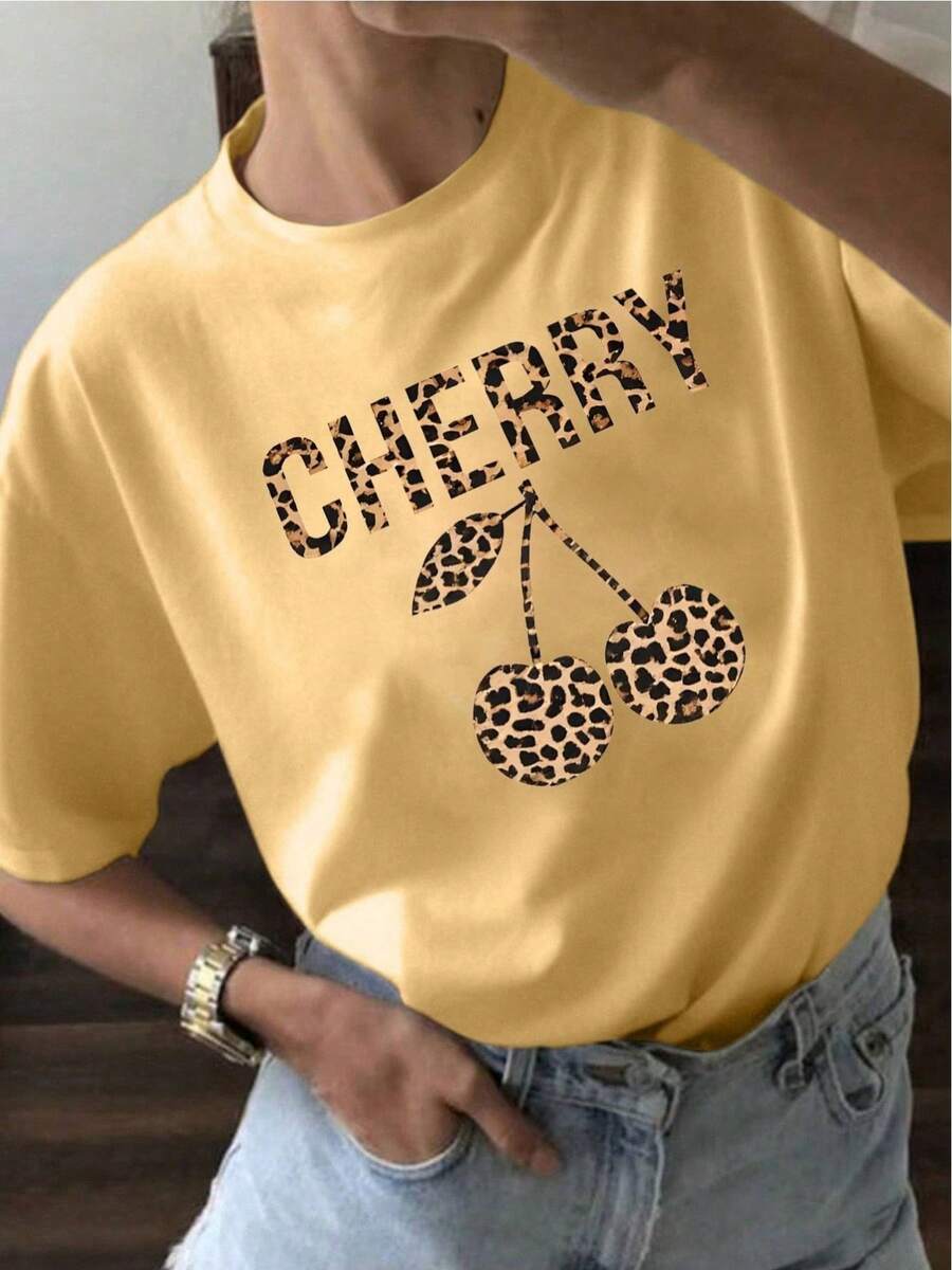 Camiseta de manga corta ajustada de verano para mujer YOCASA con cuello redondo y estampado de pintura al óleo, flores, corazones, cerezas y letras. Tela sencilla y casual, estilo deportivo, ideal para uso diario y citas de San Valentín. 1 pieza, 180g Pure Heavy, 95% poliéster 5% spandex - Amarillo - Ver 1