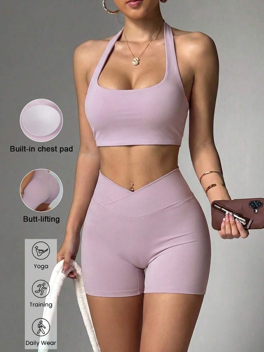 Bộ đồ thể thao nữ mùa hè màu trơn Aoqta Sports gồm hai mảnh: áo tank top không tay kiểu racerback có đệm ngực và quần short cạp chéo ôm bụng, phù hợp cho yoga, chạy bộ, tập luyện và mặc hàng ngày. - Màu tím - Xem 1