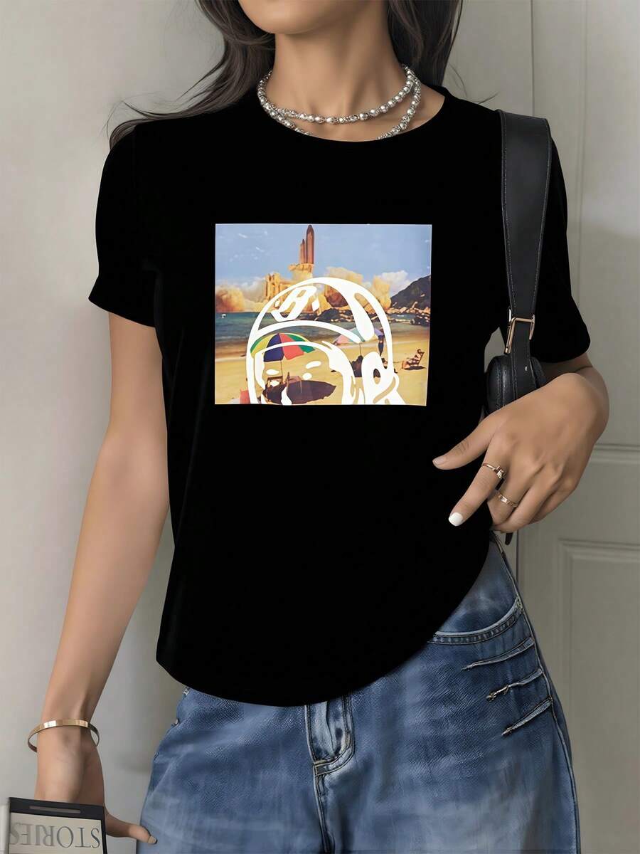 Colorful Astronaut Enjoying A Beach Landscape With Mountains In The Background And A Rocket Taking Off Symbolizes Adventure, Exploration, And Inner Calm. Modern, Comfortable, And Casual Women's T-Shirt - Black - View 1