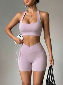 Bộ đồ thể thao nữ mùa hè màu trơn Aoqta Sports gồm hai mảnh: áo tank top không tay kiểu racerback có đệm ngực và quần short cạp chéo ôm bụng, phù hợp cho yoga, chạy bộ, tập luyện và mặc hàng ngày. - Màu tím - Xem 3