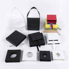 A Transparent Film Suspended Jewelry Packaging Display Box, Available In Multiple Colors, Includes A Matching Paper Outer Box. It Can Store Rings, Earrings, Bracelets, And Other Types Of Jewelry. Features Scratch-Resistant And Dust-Proof Design, Combining The Functions Of Store Display And Holiday Gift Packaging. A Simple And Practical Universal Jewelry Storage Box - White Film Box; 11*11 - View 6