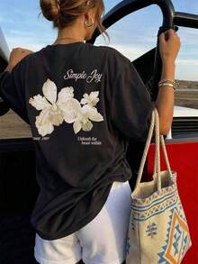 This Short-Sleeve Crew Neck T-Shirt With A Colorful Letter And Floral Print Is A Fashionable And Versatile Choice For Women In Summer. The Graphic Tee Comes In White And Pink, Perfect For Vacation Wear. 100% Cotton - 2 - 查看 1