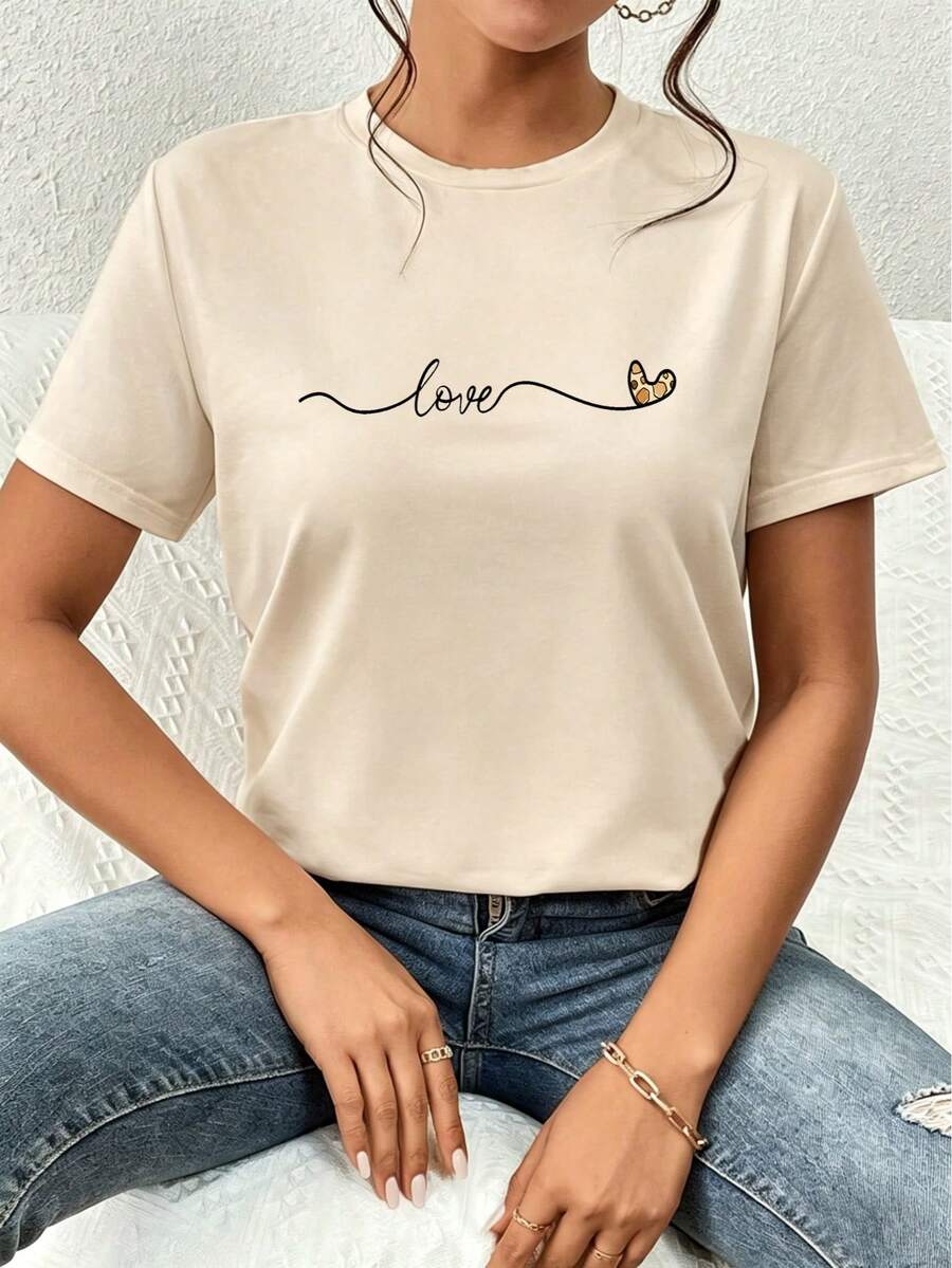 Camiseta de verano sencilla para mujer, de manga corta y cuello redondo, corte regular, estampado de corazones LOVE, versátil y elegante para el día a día. - Albaricoque - Ver 1