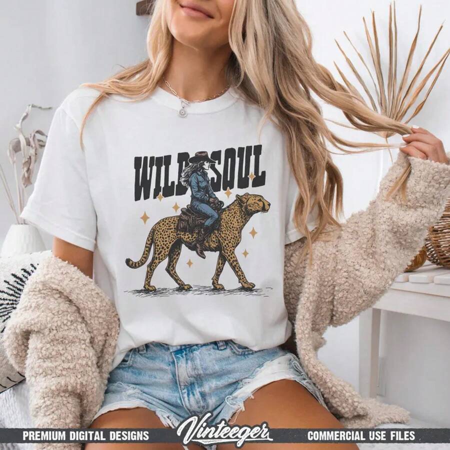 Wild Soul: Cowgirl Riding A Cheetah. Retro Western Graphic Design For A T-Shirt. Country Girl Sublimation Design. Printable Design. - White - View 1