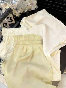 Pantalones rectos de cintura alta con goma elástica de satén, con brillos y anudado a la cintura - Amarillo - Ver 5