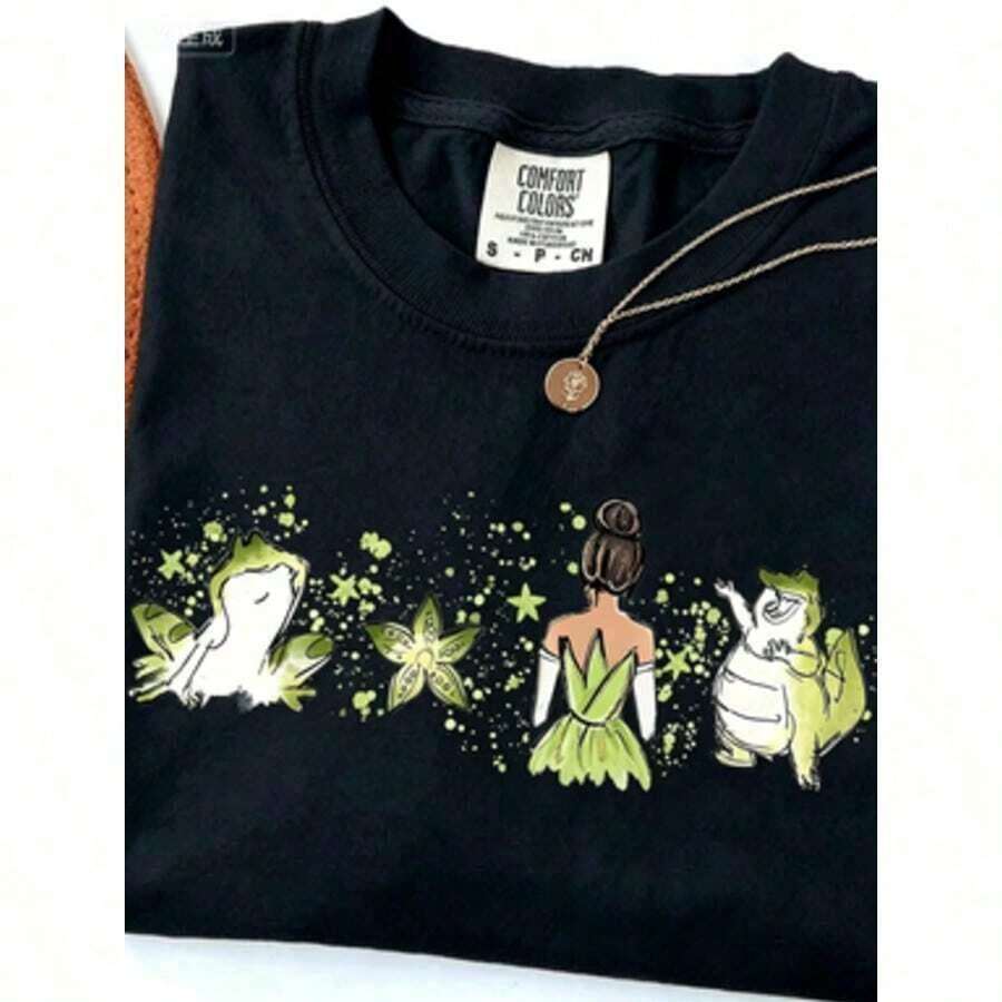| 1 Playera para Mujer 100% Algodón Transpirable | Camiseta oficial de la Princesa y el Sapo Tiana para mujer - Diseño de aventura es la bahía de acuarela y la casa de Tiana es Nueva Orleans, cuello redondo suave, manga corta, informal y elegante para fiestas, cómoda para todos ellos las estaciones, lavable a máquina conjunto de ropa temático para la familia, ropa de invierno para mujer - Ideal para el verano. Camiseta de algodón puro de corte holgado y estilo casual - Negro - Ver 1