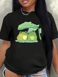 Camisa tipo Y2K con diseño de ranas adorables bajo una hoja fresca perfecta para destacar tu estilo único y original ideal para los amantes de la moda mexicana puedes usarla en cualquier ocasión y hacer una declaración de estilo auténtica EBYM - Negro - Ver 1