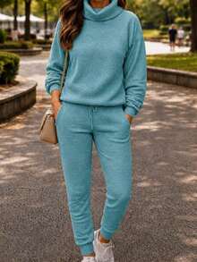Set Of Pants And Turtleneck Sweater In Mousse Knit Fabric. - Pool Blue With Handle - View 2
