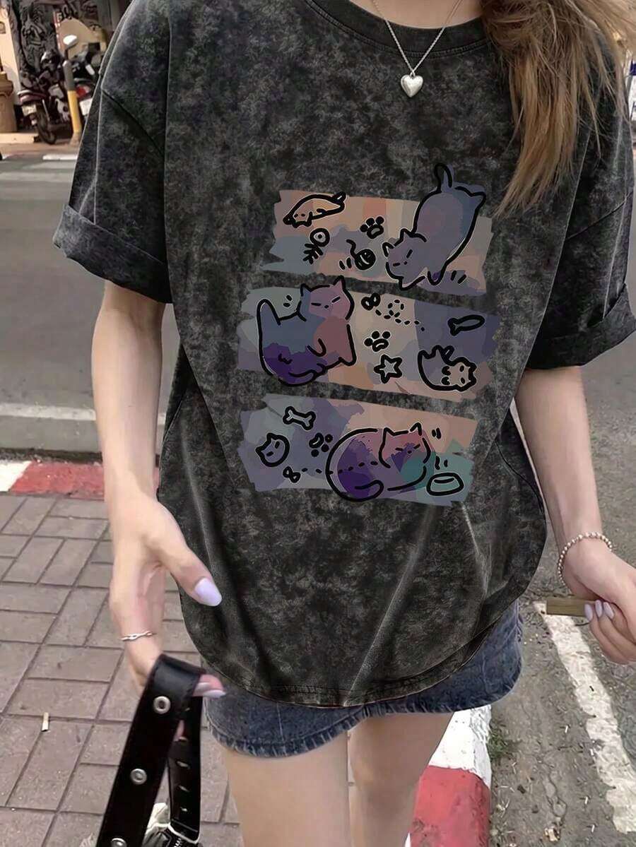 Camiseta de manga corta para mujer, estilo japonés, holgada, informal, con cuello redondo y estampado de gato de dibujos animados, modelo primavera/verano, negra. - Negro - Ver 1
