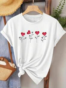 Camiseta vintage de manga corta y cuello redondo, adornada con estampados florales en forma de corazón, que muestra un estilo fresco y natural, de corte holgado, adecuada para un estilo casual minimalista en primavera y verano, elegante para fiestas y uso diario casual para mujeres, ecológica. - Blanco - Ver 1