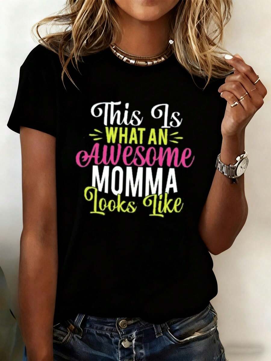 Talla - Talla - Camiseta Divertida para Mujer con la Impresión 'Esta una Mamá Genial' | Camiseta negra de 180 g/²,% algodón, con letras rosas y verdes - Estilo retro Y2K, cuello redondo, tela ligeramente elástica - Camiseta unisex de manga corta, cuello redondo, estilo vintage urbano y holgado. - Negro - Ver 1