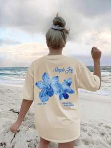 Esta camiseta de cuello redondo con estampado floral y letras coloridas para mujer es moderna y versátil.La camiseta gráfica viene en blanco y rosa, adecuada para usar en vacaciones.Verano Casual - Albaricoque - Ver 6