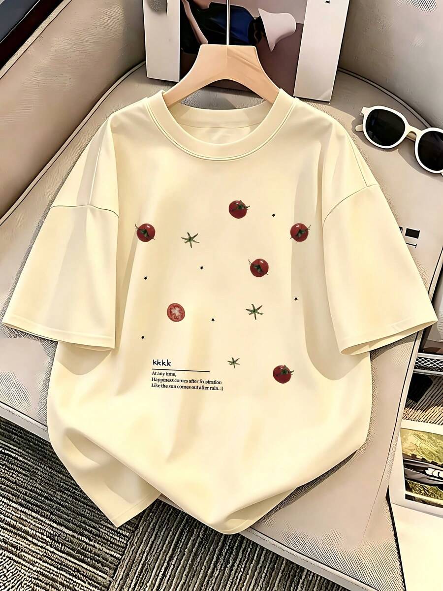 Camiseta de manga corta de corte holgado con hombros caídos, con estampado de racimo de estrellas de tomate y frases en inglés, camiseta de cuello redondo de corte holgado, top único y moderno para mujer. - Albaricoque - Ver 1