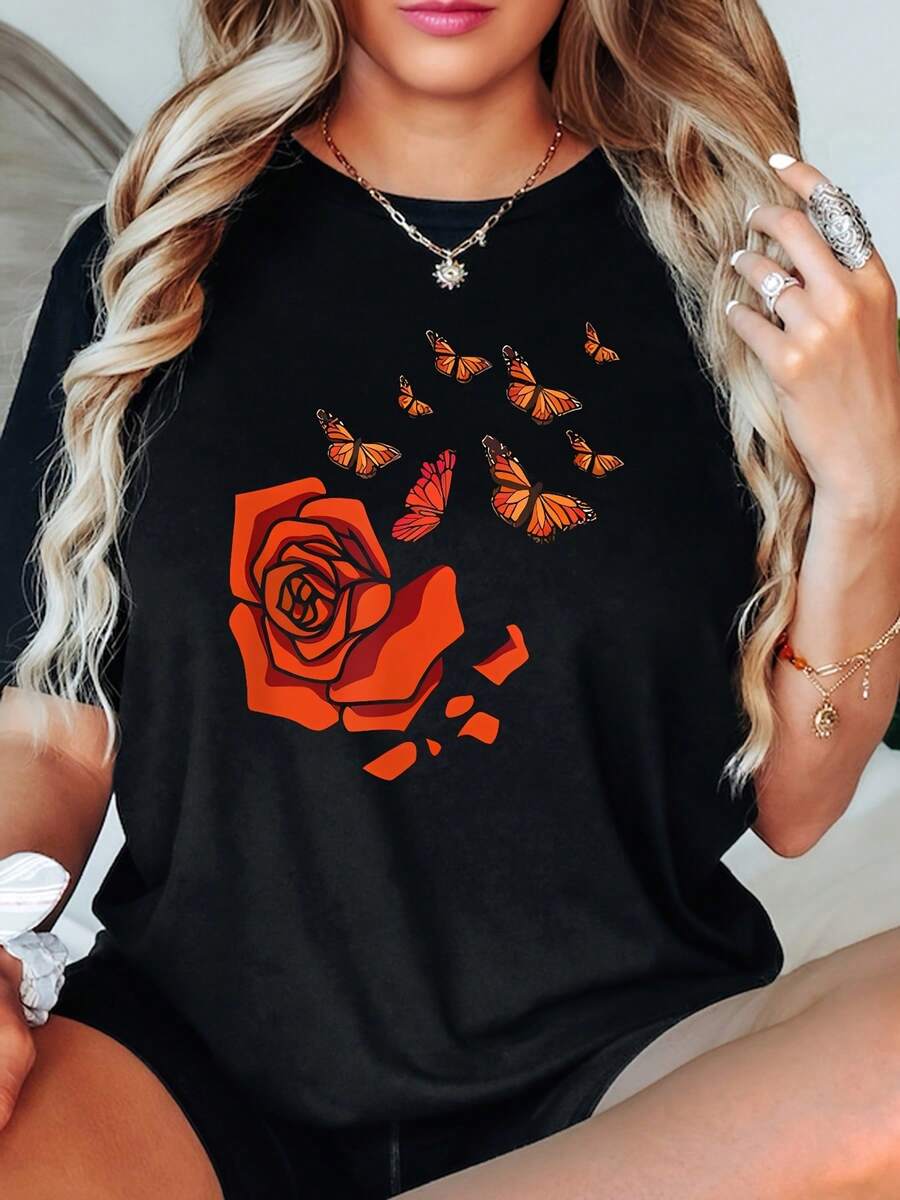 Ropa de talla para mujer, camiseta de talla para mujer con estampado floral negro - diseño de rosas rojo brillante y mariposas coloridas, mangas cortas de cuello redondo suaves y elásticas, top casual cómodo para todos los días y para todas las estaciones, camisa de tela suave apta para tallas grandes (base negra con diseño de rosas naranjas y mariposas coloridas) - Camiseta unisex de manga corta y cuello redondo de algodón suelto estilo vintage urbano. - Negro - Ver 1