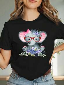 Una camiseta de manga corta para mujer, moderna, a la moda, retro, casual y holgada, adecuada para actividades al aire libre en primavera y verano, con diseño de elefante con corbata de lazo y gafas - top de manga corta con cuello redondo, suave y transpirable, estampado de elefante, ligero y casual para el verano, ideal para el uso diario, lavable a máquina, apta para todas las estaciones.blusas para mujer,blusas casuales para dama,tops,, mujer premium,y2k,playeras de mujer curvy,ofertas y liquidaciones ropa mujer,playeras deportivas para mujer,,playeras de hombre, mujer,blusas>elegante ESAN - Negro - Ver 1