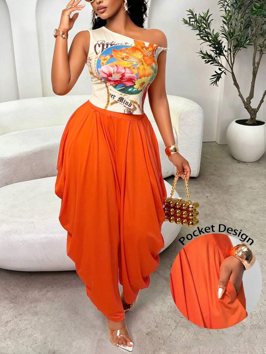 Bộ đồ 2 món mùa hè dành cho nữ của Aliling, gồm áo in họa tiết cổ bất đối xứng phối cùng quần ống rộng xếp ly có túi, phù hợp cho mặc hàng ngày, đi club, dự lễ hội âm nhạc và các bữa tiệc thanh lịch. - trái cam - Xem 1
