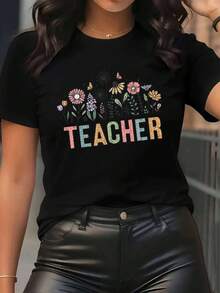 Camiseta de manga corta para mujer con estampado floral de "TEACHER", fondo negro y dise￱o de flores brillantes. Ropa casual ideal para profesores, ligera y c￳moda, perfecta para el uso diario. - Negro - Ver 2