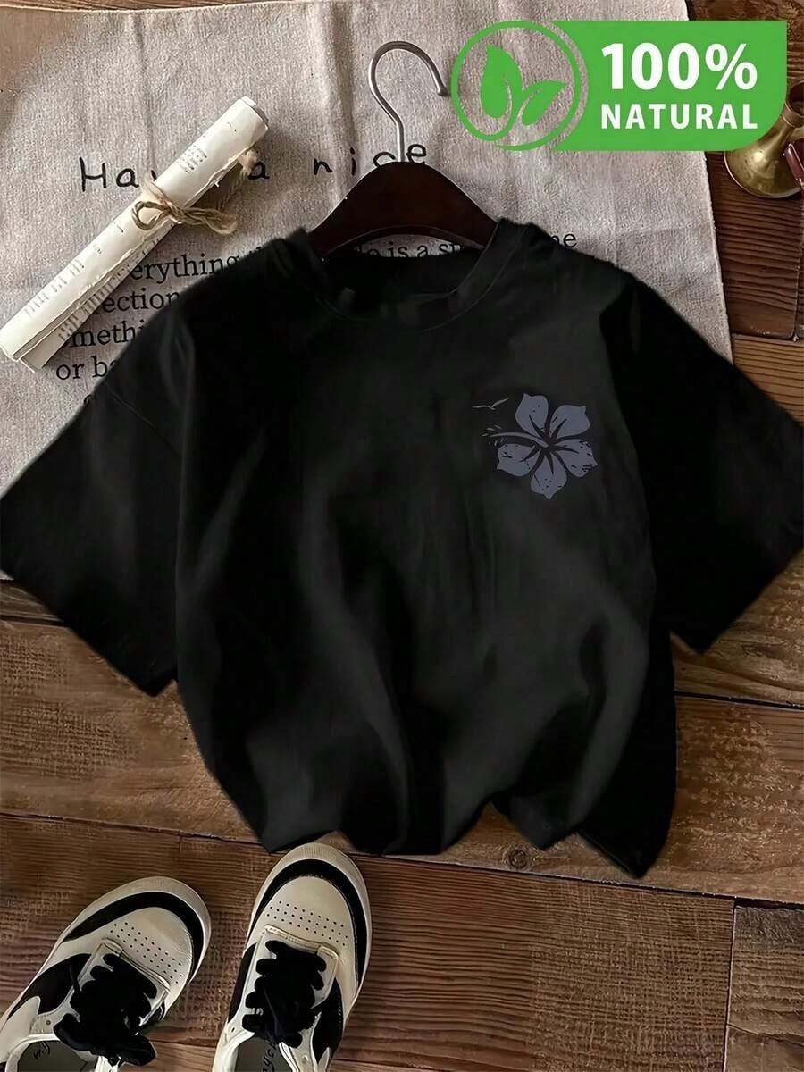 Playera negra con diseño de flor discreta para estilo casual moderno y cómodo ideal para salir. Perfecta para completar tu outfit con minimalista y destacarte en cualquier momento con su elegancia simple. Indispensable para impresionar en la moda urbana mexicana. - Negro - Ver 1