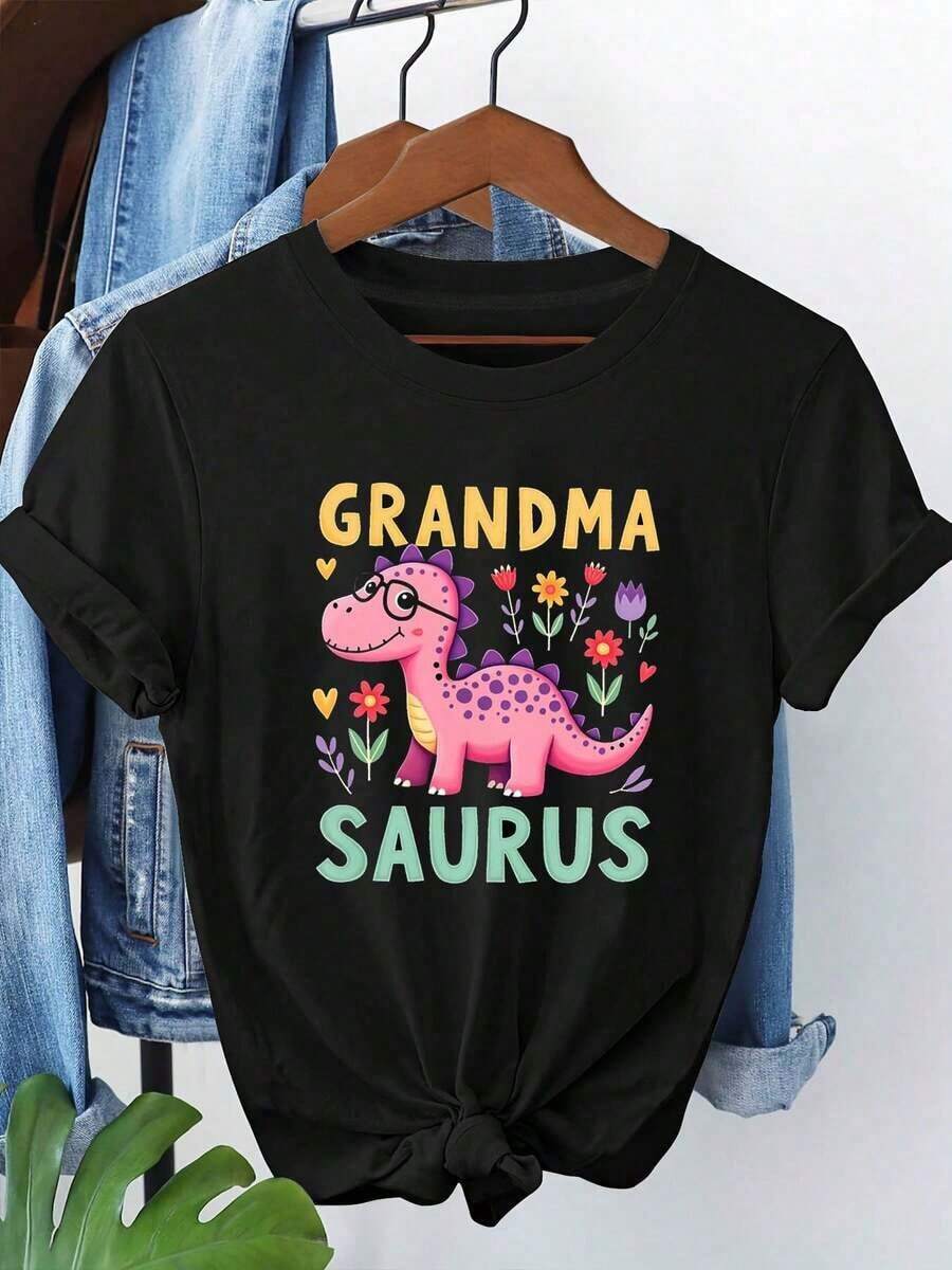 Camiseta gráfica 'Abuela Saurus' para mujer - Lindo dibujo animado de dinosaurio con detalles florales, camiseta casual de manga corta negra, para primavera-verano, regalos para abuelas. - Negro - Ver 1