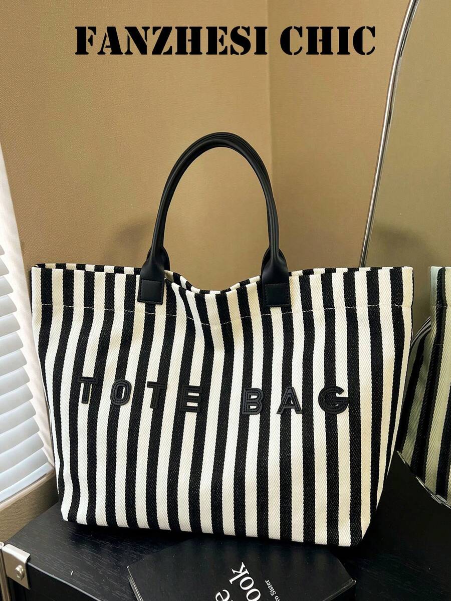 Esta bolsa de mano casual pero elegante con rayas multicolor presenta asas de cuero, letras 3D y una gran capacidad, lo que la hace adecuada para estudiantes y profesionales que la pueden usar a diario, incluyendo ir a clase, ir al trabajo y hacer compras. - Multicolor - Ver 1