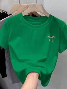 1 Camiseta de Moda Casual para Hombre y Mujer, hecha de 100% algodón, suave y cómoda, con mangas cortas y cuello redondo, con un pequeño estampado de lazo rosa - Ligera, versátil, fácil de combinar, adecuada para uso diario, estilo urbano, conjuntos de vacaciones y atuendos de fin de semana. - verde jade - Ver 6