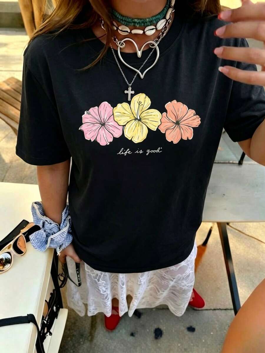 Oferta limitada en tiempo limitado T-shirts Women's Letter Camiseta divertida Promoción de nuevo lanzamiento Print T-shirts Camiseta de manga corta con cuello redondo elástico, estampado de hibisco y eslogan colorido, nuevo estilo de verano para mujer. Estilo retro suave, llamativo y cómodo, adecuado para el campus/ir al trabajo, reuniones de fin de semana, fiestas de verano en el patio, citas informales de verano. RLWZ - Negro - Ver 1