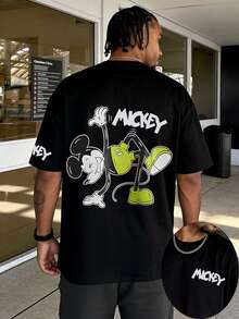 Disney Classic Playful Mickey Mouse Acrobatic Graphic T-Shirt, Green Shorts Mickey Figure With Handwritten MICKEY Font Back Print Short Sleeve T-Shirt, Black Timeless Crew Neck Casual Top, Matching Mini MICKEY Font Chest And Sleeve Two-Sided Print Detail, Soft Skin-Friendly Breathable High-Quality Cotton Fabric Construction, Reinforced Seams For Durable Long-Term Daily Use, Casual Street Life Everyday Holiday Daily Outfit, Matching Clothing For Young Adults And Couples, Iconic Disney Mickey Mouse Cartoon Character-Centered Design, Casual Urban Visual Style Suitable For Everyday Scenarios, City Meetups, Leisure Events, And Comfortable Everyday Design - màu đen - Xem 1