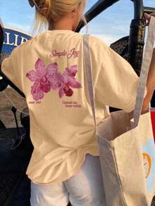 Soft Women's Crew Neck T-Shirt With A Colorful Letter And Floral Print, A Fashionable And Versatile Relaxed Oversized Fit. Graphic Blouses For Women In White And Pink, Vacation Outfits For Women. - 杏色 - 查看 1