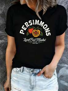 Camiseta negra para mujer, con un diseño de caqui inspirado en el mercado local de frutas, perfecta para el verano. Esta elegante prenda lavable aáquina, adecuada para todas las estaciones y - Negro - Ver 1