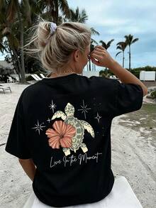 Nueva camiseta de cuello redondo de algodón puro para mujer, modelo 2026, ideal para el verano, con estampados de tortugas, flores y letras. Perfecta para vacaciones en la playa. - Negro - Ver 4