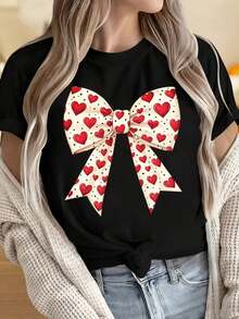 Camiseta de manga corta con cuello redondo para mujer, estampado de lazo de corazón, camiseta casual de manga corta para mujer, top lindo y a la moda para el Día de San Valentín, color blanco, estampado divertido para el Día de San Valentín, adecuada para fiestas de Navidad, actividades deportivas, salidas de vacaciones, citas, deportes, ocio diario, ocasiones de regalo de vacaciones. - Negro - Ver 4