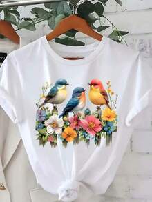 Camiseta Estilo Urbano para Mujer con Estampado de Aves y Flores Vibrantes - Corte Relajado, Manga Corta, Cuello Redondo, Azul Pastel y Multicolor, Top Casual de Primavera Verano con Diseño de Colibrí y Flores, Tela Ligera y Transpirable para Uso Diario, Viajes y Actividades al Aire Libre - Blusa Blanca Lavable a Máquina con Patrones Aleatorios de Aves y Flores, Cómoda para Primavera/Verano, Fácil Cuidado y Estilo Versátil, Camisetas para Mujer, Camisetas de Talla Grande para Mujer, Camisetas de Talla Grande para Dama, Camisetas para Mujer, Camiseta Casual de Talla Estándar para Mujer, Transpirable, Ligera, de Manga Corta, Camiseta informal negra de cuello redondo para hombre, camisas para niños, ropa para niñas, conjuntos de chicas de televisión, conjuntos a juego para madre e hija, adecuado para regalos de Día de San Valentín, unisex - Blanco - Ver 1