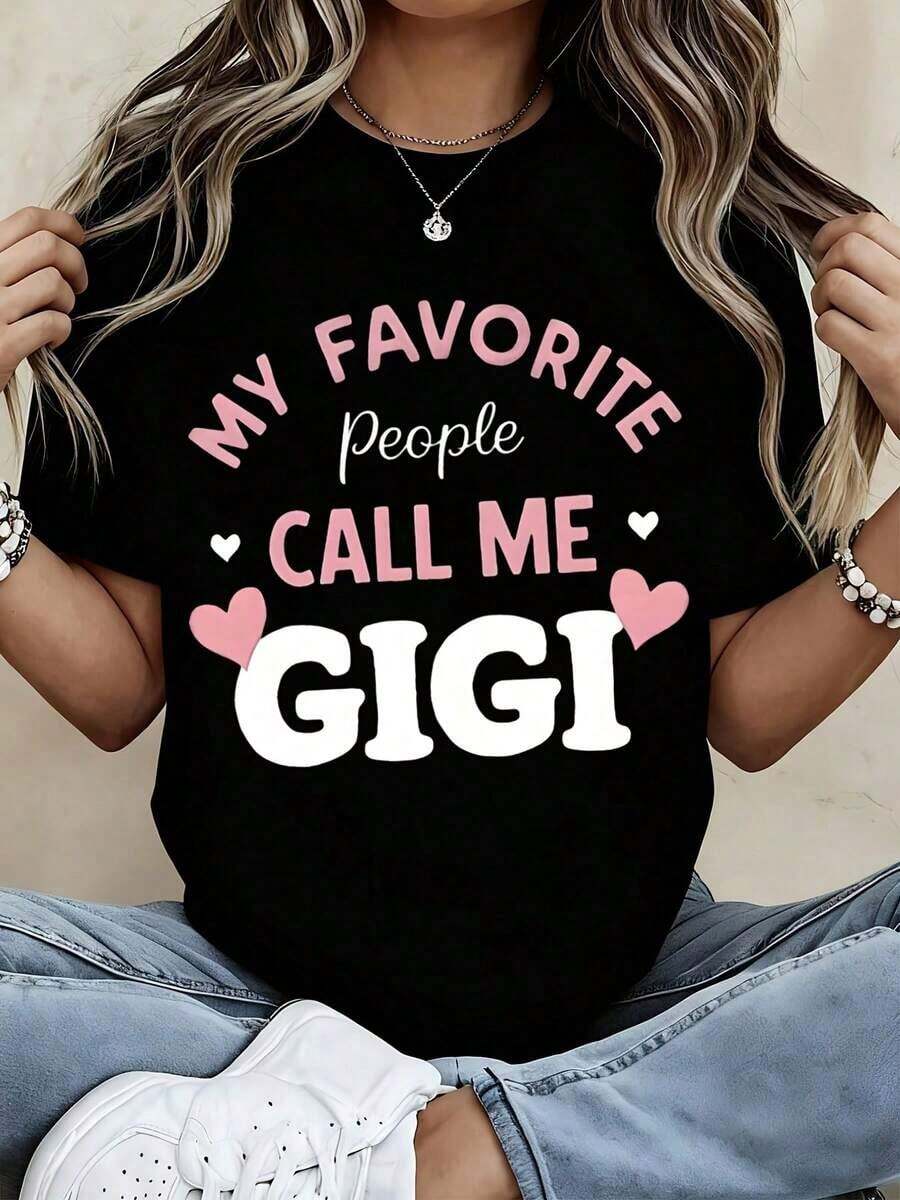 Camiseta Casual Blanca de Cuello Redondo para Mujer con Estampado de "Mis Personas Favoritas Me Llaman Gigi" y Corazones Rosados - Regalo Casual para Abuela para Salidas Familiares, Vacaciones y Uso Diario. - Negro - Ver 1