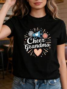 Camiseta de mujer con estampado de trompetas, fuegos artificiales y el texto "Cheer Grandma", cuello redondo, manga corta, para primavera y verano. Adecuada para salidas informales, regalos navideños, reuniones de amigos, fiestas de música y ropa de vacaciones. - Negro - Ver 1