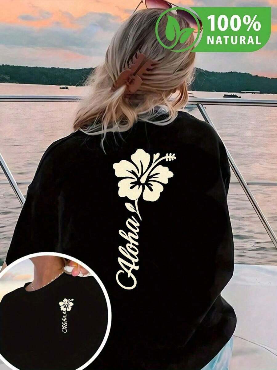 Camiseta Negra Estilo Playa de México con Estampado de Hibisco y Texto Aloha para Mujer - Ideal para Verano y Vacaciones - Diseño Único y Moderno - Perfecta para Atardeceres y Escapadas - Ropa Casual y Confortable para Cada Día - Negro - Ver 1