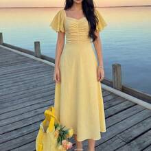 guangzhougaolangshangmao  Vestido elegante y romántico de manga corta, cintura recogida y plisado en A, de longitud media, en color amarillo tejido, para primavera/verano - Amarillo - Ver 9
