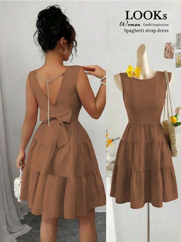 Vestido midi elegante para mujer de unicolor con cintura ajustada, sin mangas, con decoración de cadena y lazo - Marrón - Añade 8
