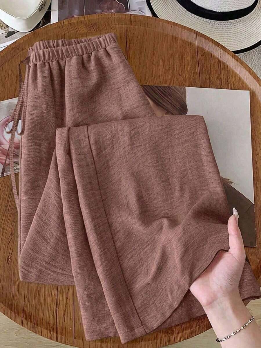Pantalones anchos de pierna ancha de satén negro de larga duración con ajuste cómodo para mujeres, pantalones de satén negro, pantalones de seda para mujeres, pantalones de satén negro, pantalones de seda negra, pantalones casuales para mujeres - Óxido marrón - Ver 1