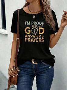 I Am Proof That God Answers Prayers - Short Sleeve T-Shirt With Cross Print - Women's Christian Faith Inspirational Graphic Tee, Casual Sweater With Religious Cross Design, Soft, Breathable, Medium Stretch Fabric, Machine Washable, Perfect For Daily Wear, Church, Bible Study, Or Relaxing In Spring, Summer, And Autumn. - 黑色 - 查看 1