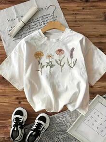 Una camiseta vintage con estampado floral de mujer para primavera y verano con un top de manga corta de cuello redondo, ropa de mujer JNNA - Negro - Ver 1