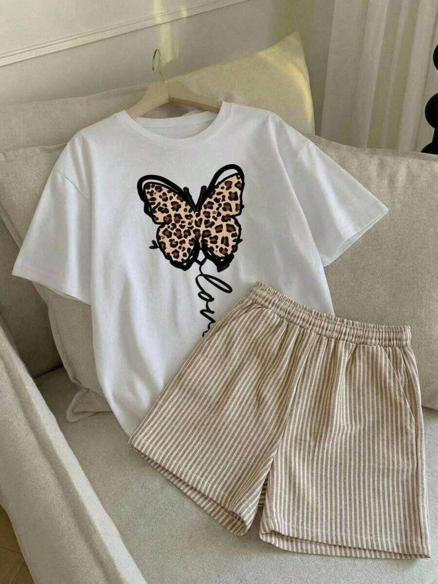 Almacén local, una camiseta de manga corta para mujer con estilo retro americano, de corte holgado y diseño estampado (los pantalones son solo para sugerencias de estilo). Esta pieza sencilla y elegante presenta un patrón de letras impresas con temática tropical, lo que la convierte en un elemento imprescindible para crear un look relajado de vacaciones, perfecto para ocasiones como el Día del Trabajo y el Día de la Independencia de México. - Blanco - Ver 1