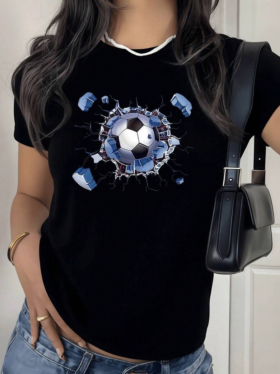 A Soccer Ball Breaking Through Barriers And Blue Stone Structures Symbolizes Unwavering Strength And Determination On The Field. A Women's T-Shirt With This Powerful Representation For Lovers Of The World's Most Popular Sport, Expressing Passion And Feminine Energy In Every Play. - 黑色 - 查看 1
