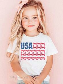 Camiseta de EE. UU., Camiseta Coqueta con Bandera para Niñas, Camiseta Patriótica para Niños Pequeños del 4 de Julio, Camiseta Preppy con Lazo Coqueta, Camiseta Floral de EE. UU., Camiseta Coqueta del 4 de Julio, Camiseta de Manga Corta de Verano para Mujer, a la Moda, Blusas Casuales de Cuello Redondo Lisas y Estampadas, Blusas Cómodas de Algodón Suave de Primera Calidad, Ropa Holgada y Amigable para la Calle. - Blanco - Ver 1